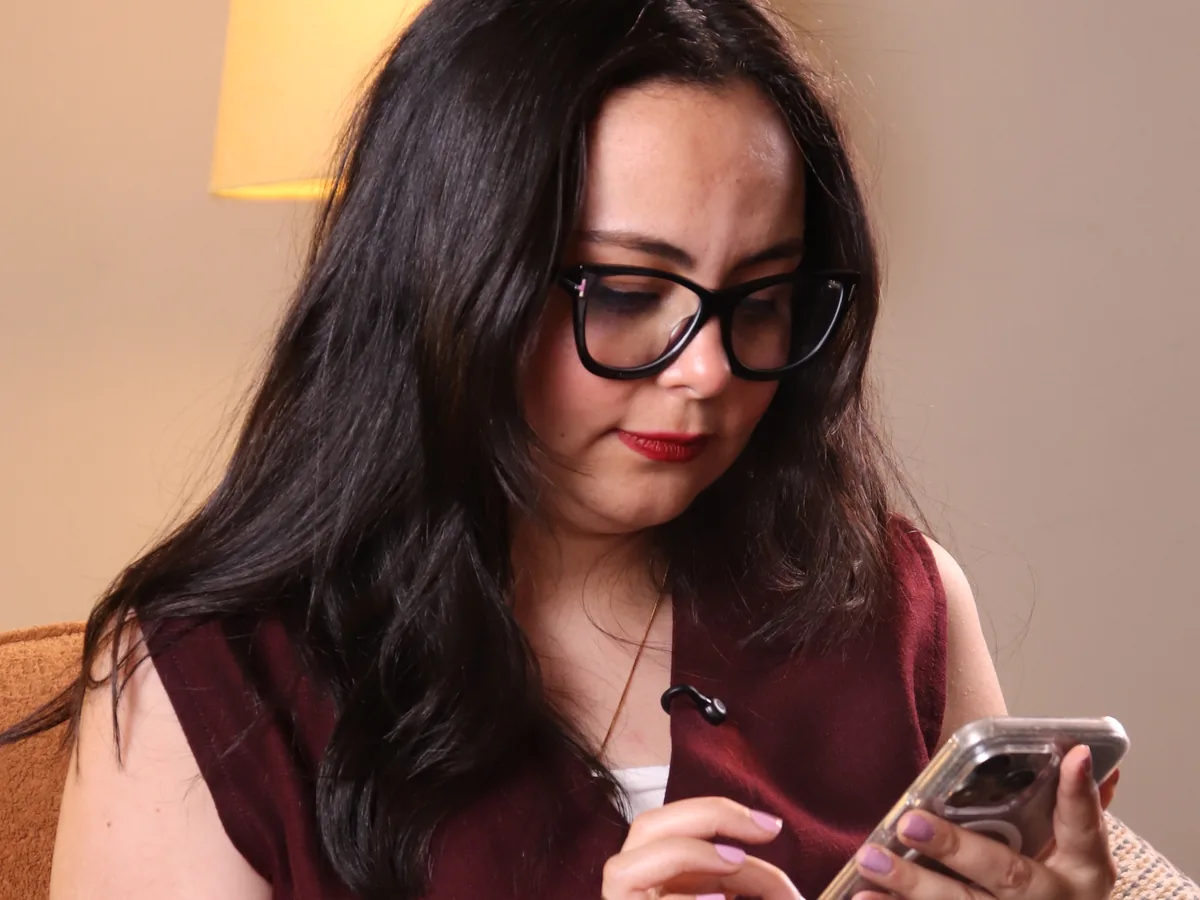 Rahma creating content on her phone